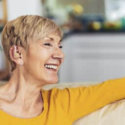 Happy woman with hearing aids