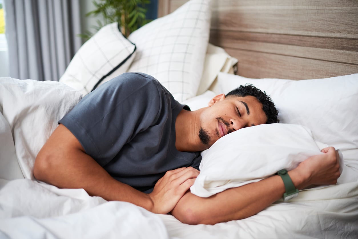 Young Man Peacefully Sleeping in a Comfortable Bed on a Quiet Morning